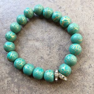 Green and gold crackle bracelet with rhinestone space beads